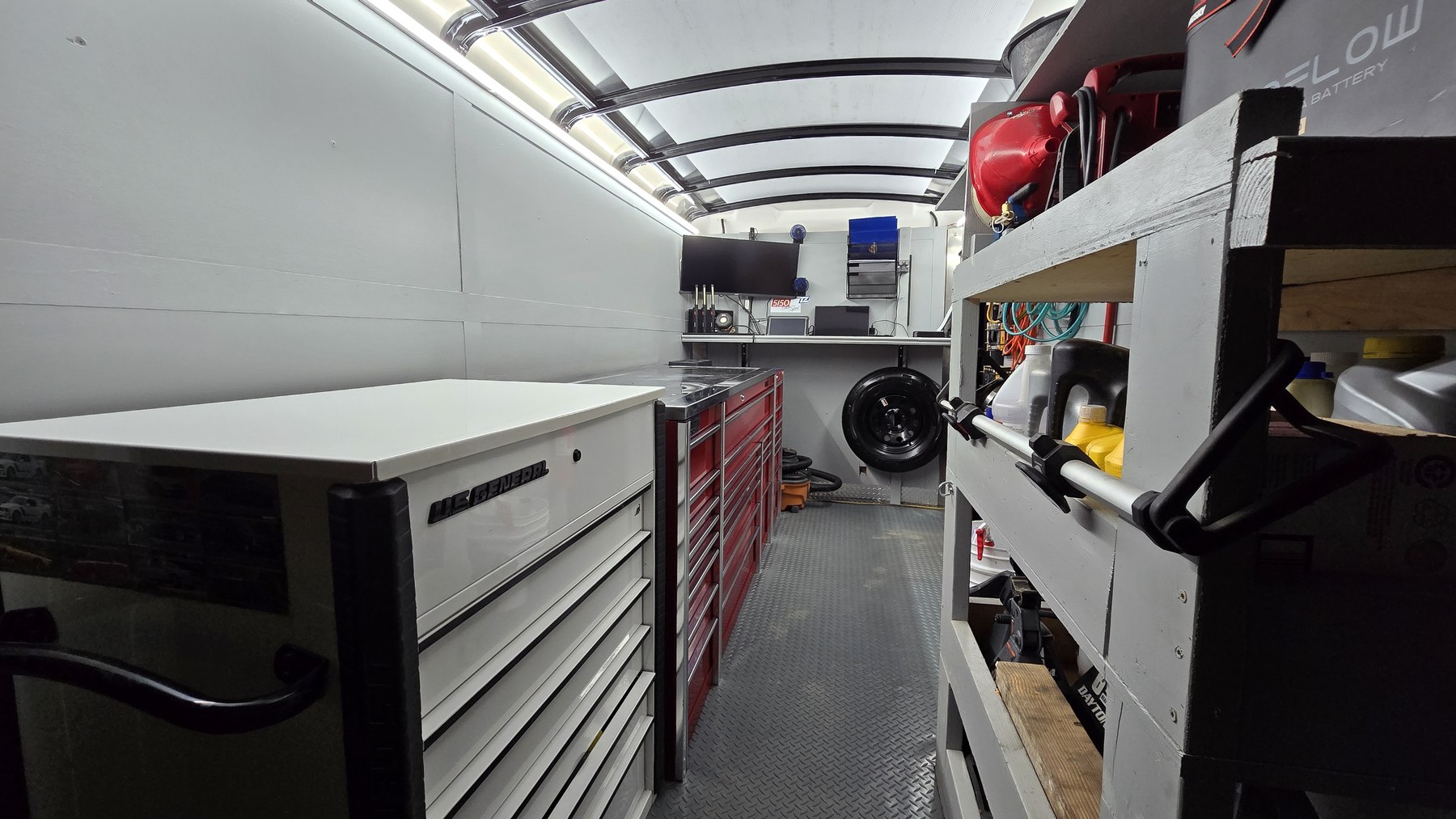 Inside the Next Gen Auto Repair mobile shop trailer — organized racks, lighting, and pro-grade equipment
